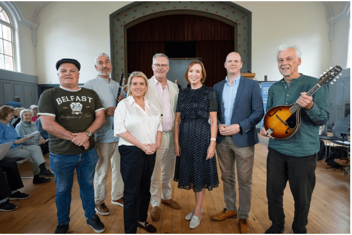 group of men and women some holding instruments&nbsp;