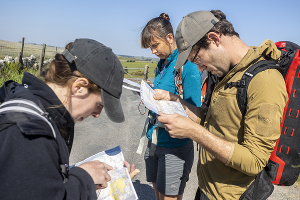 Three adults on an outdoor leadership course on Dartmoor