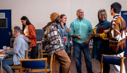 A group of customers laughing and talking together