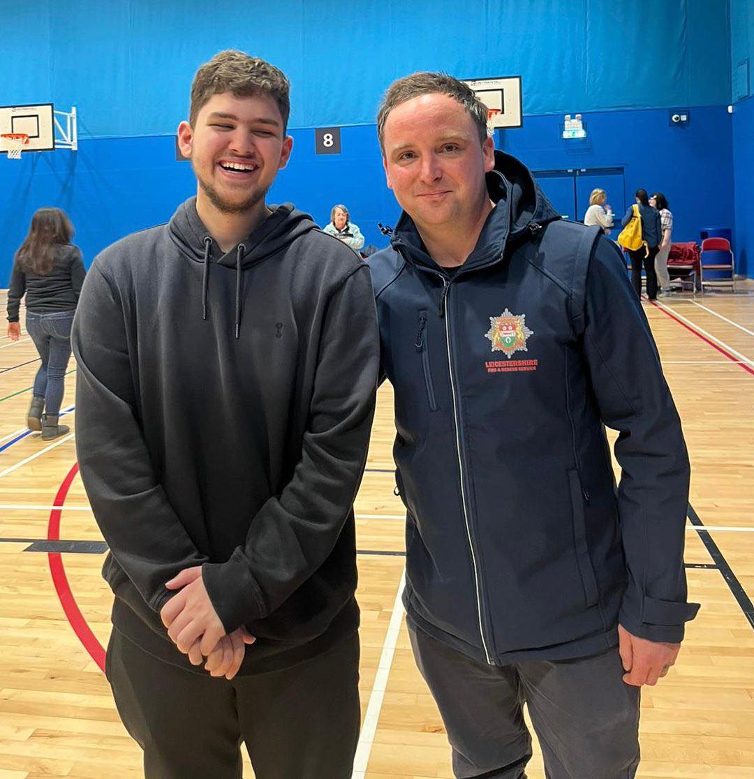 A young man supported by Enrych, alongside his dad