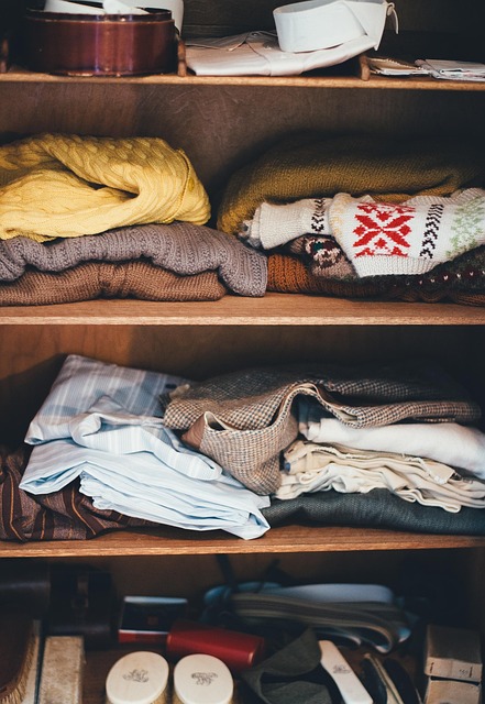 Clothes staked on shelves picture