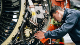 Photo of engineering student working on a propeller