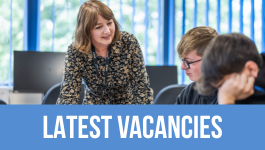 Image of teacher with students