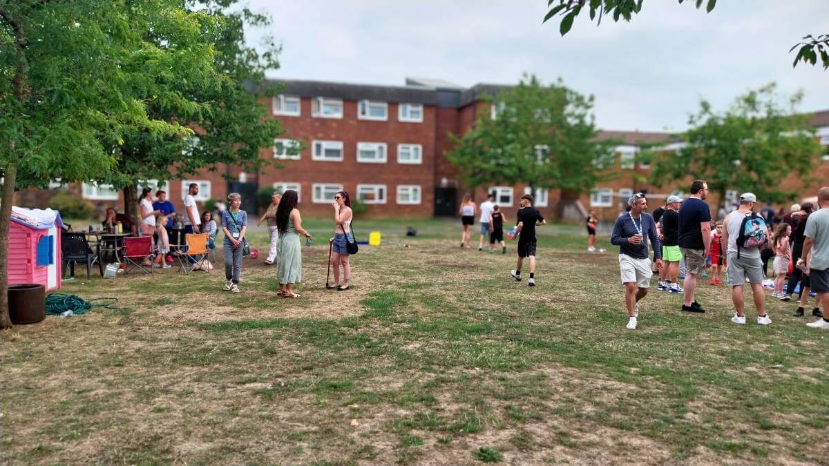 Residents enjoying a community event in an outdoor shared space