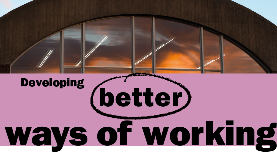 This is a subheader image. It shows a window reflecting the sun. Underneath the photo is a purple box with black text reading 'Developing better ways of working'.