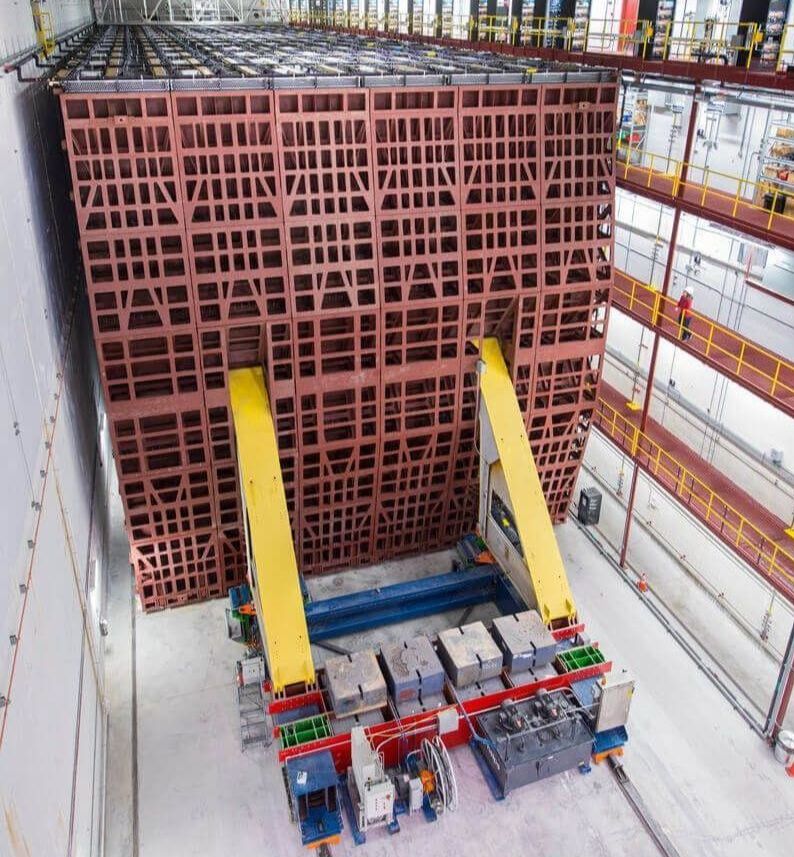 NOvA neutrino experiment’s giant grid-like particle detector, held by two yellow gantry arms, at Ash River, Minnesota.